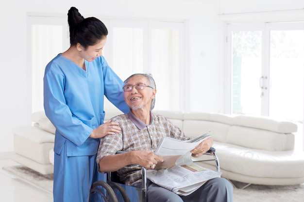 asian-nurse-take-care-elderly-senior-man-with-warm