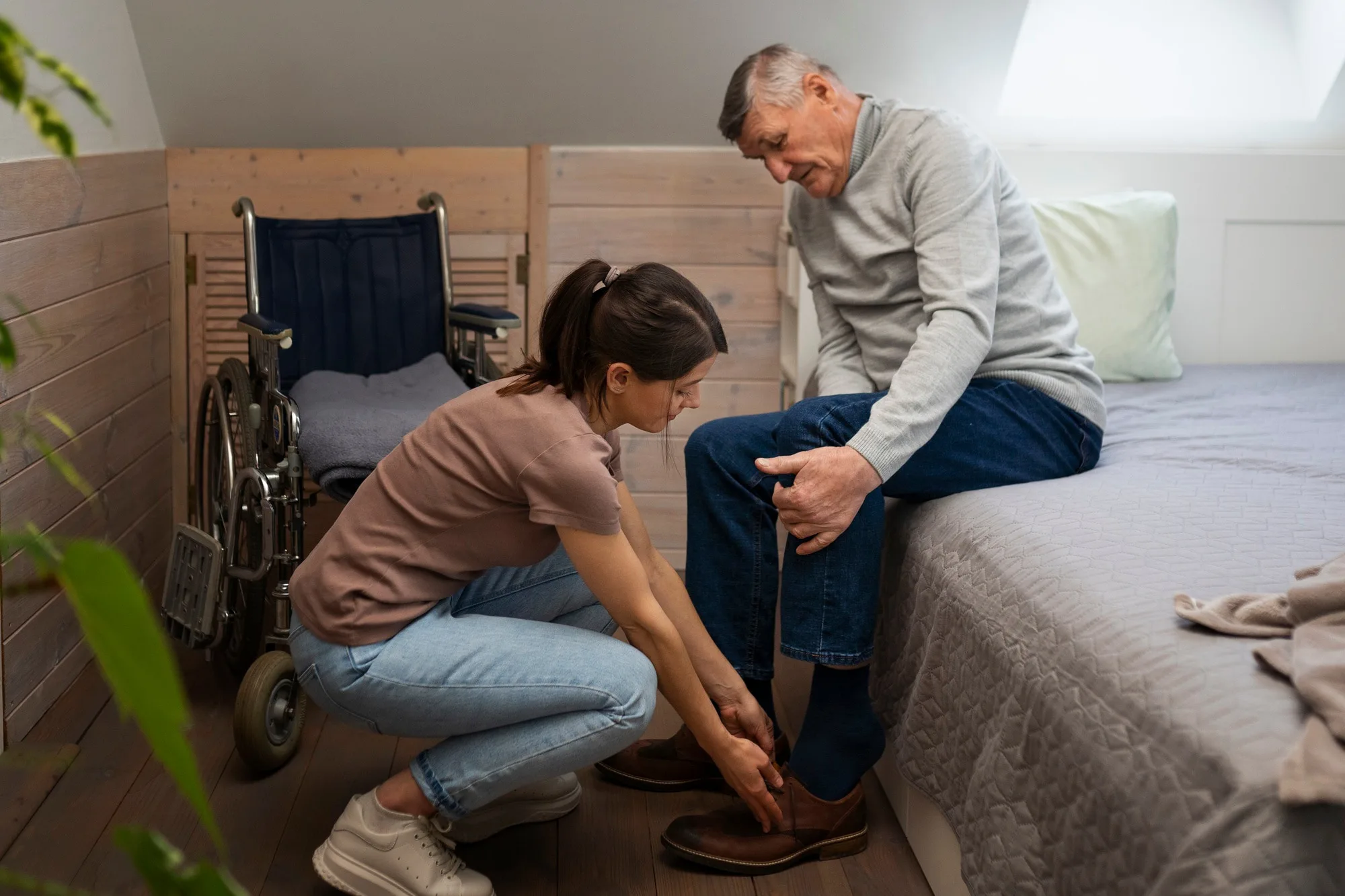 elderly-person-being-taken-care-by-female-caretake (1)
